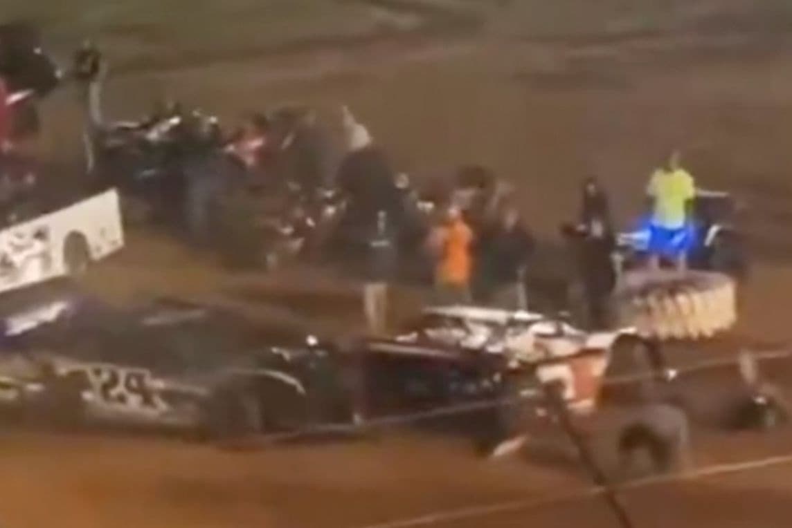 Driver arrested and banned after ramming car in the pits, knocking over crew members