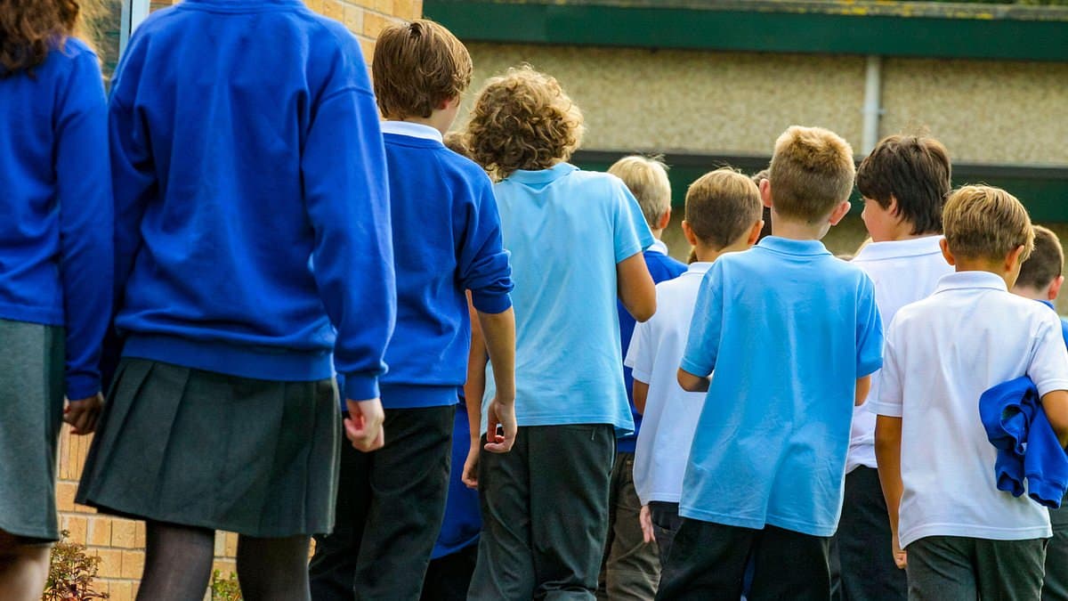 Children should be allowed to wear tracksuits in class to make school uniform 'more inclusive', MPs say