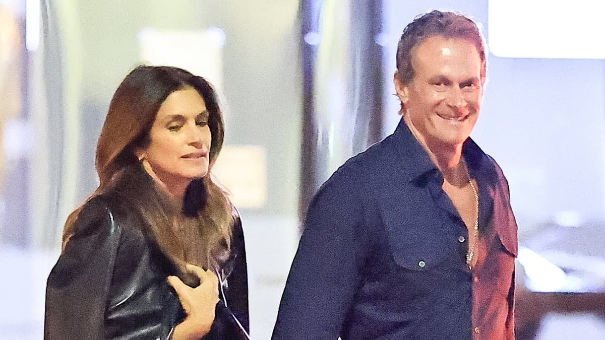 Cindy Crawford, 60, and Rande Gerber, 64, hold hands while wearing matching outfits during his Malibu birthday dinner