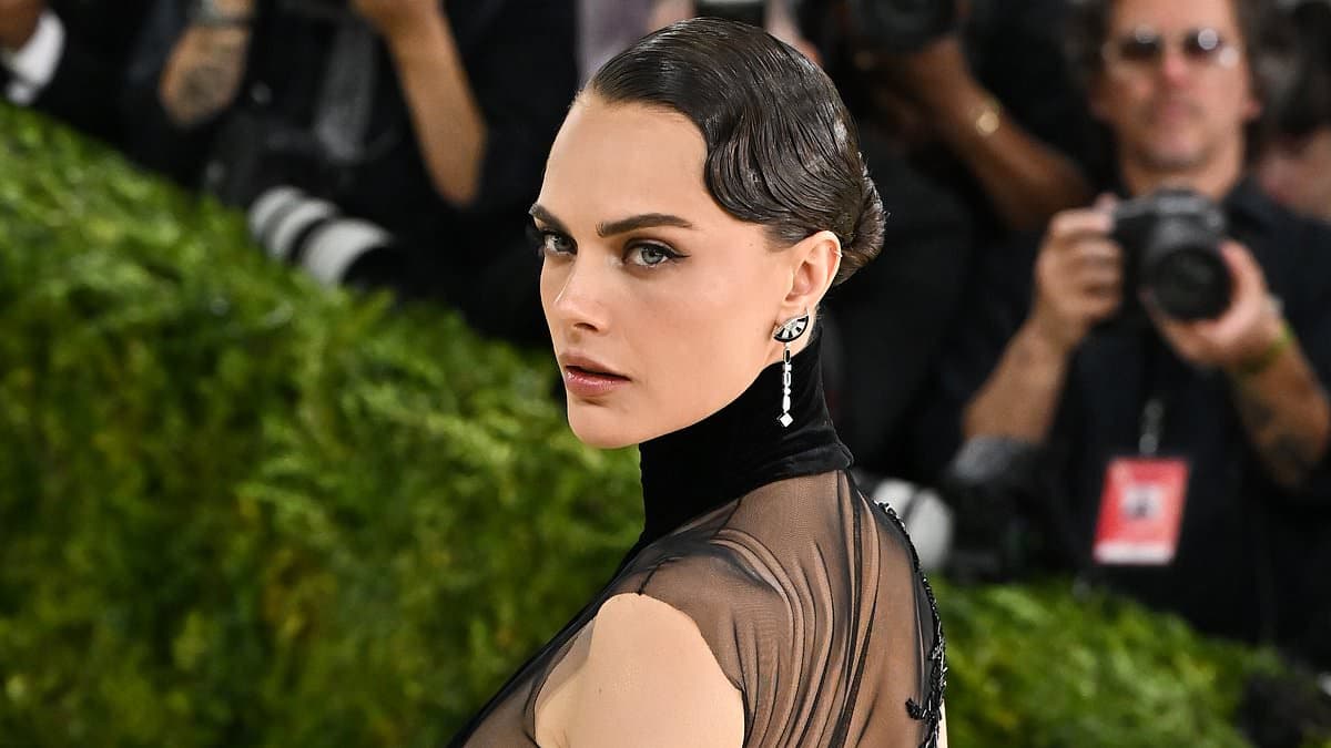 Braless Cara Delevingne, Charli XCX and Claire Foy stun in glamorous black gowns as they lead the British stars at the 2026 Met Gala