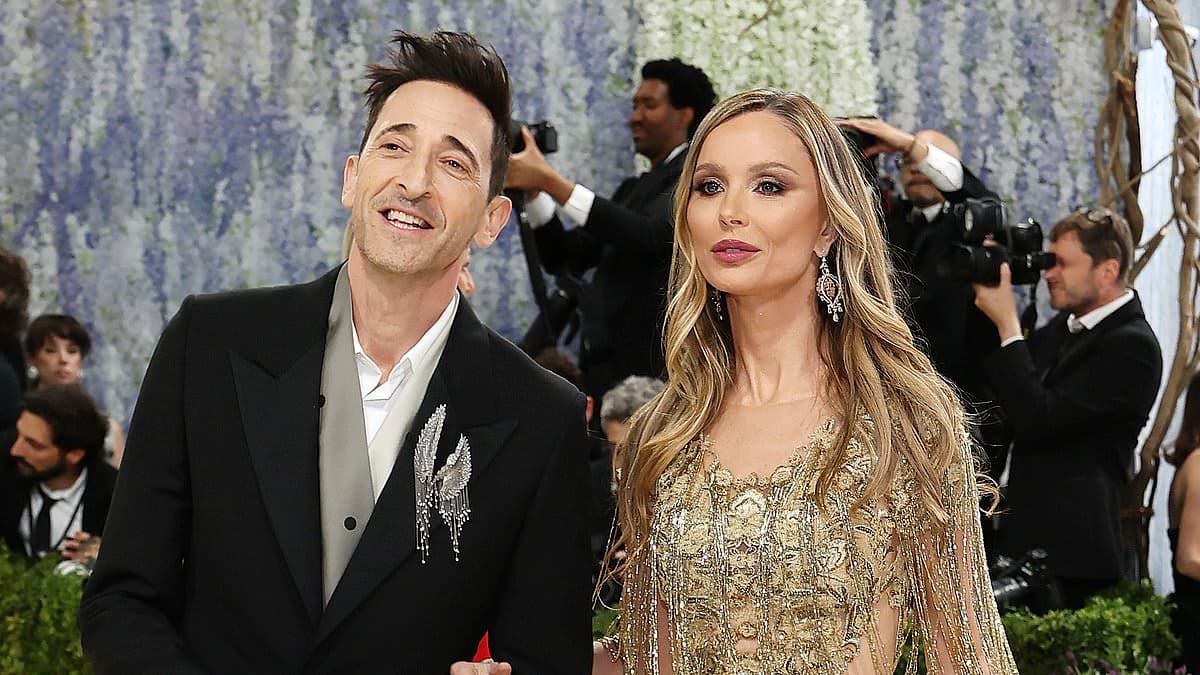 Adrien Brody's glamorous partner Georgina Chapman stuns in a gold gown as the couple make a loved-up appearance at the Met Gala 2026