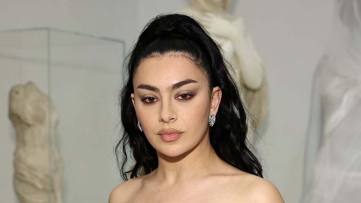 Charli XCX looks incredible in a semi-sheer strapless gown as she attends the 2026 Met Gala