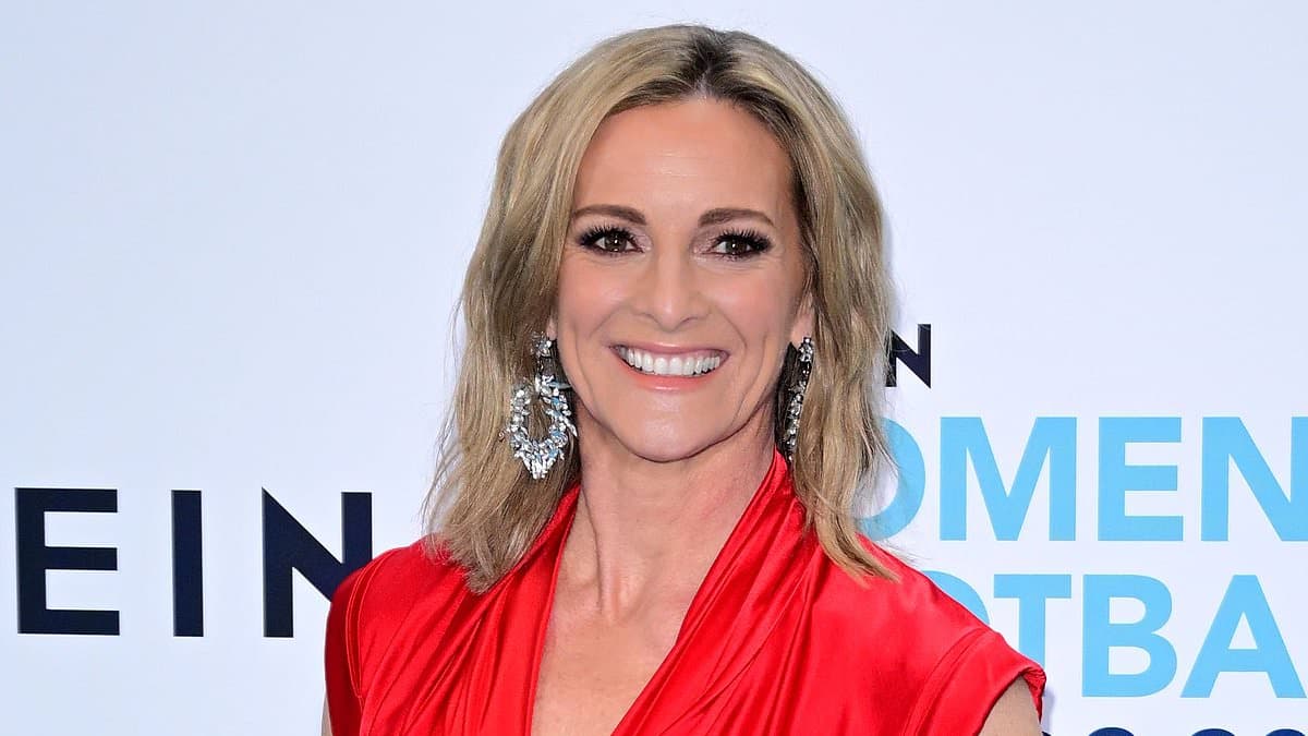 Gabby Logan looks incredible in a red satin gown as she joins stylish Denise Van Outen and Carol Vorderman at the Women's Football Awards