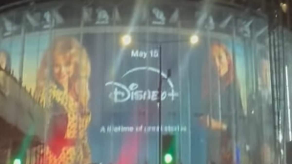 Emily Atack's sister jokes 'she's going to be insufferable' as a HUGE billboard of her Rivals character is erected at London's IMAX