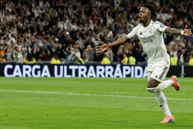 Vinicius double helps Real Madrid edge Atletico thriller