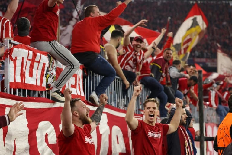 Bayern fans apologise after photographers injured at Real game
