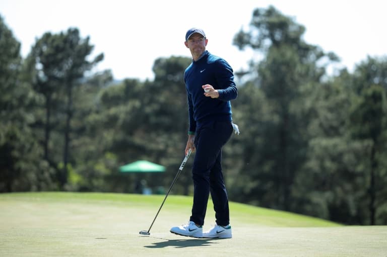 Defending champ McIlroy shares Masters lead after back-nine birdie run