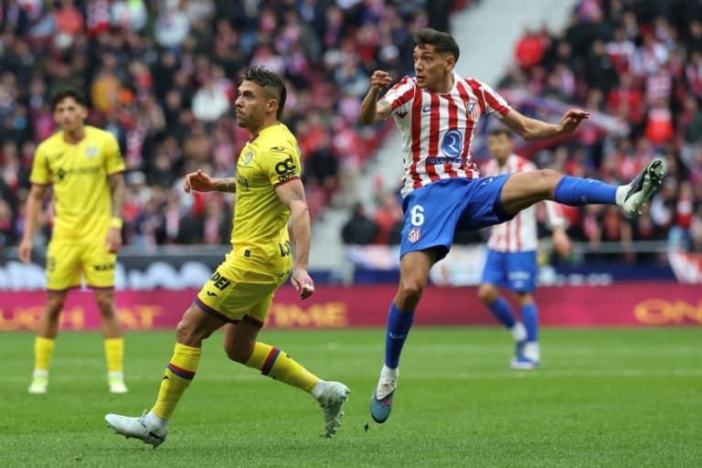 Molina rocket helps Atletico beat 10-man Getafe