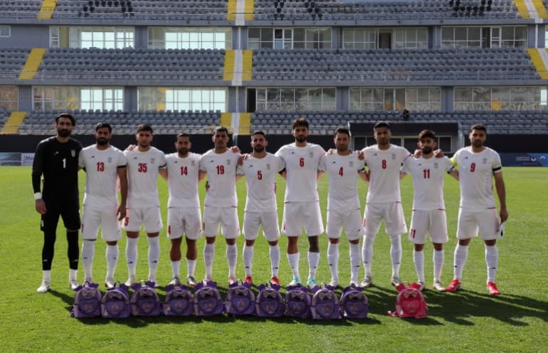 Iran footballers pay tribute to victims of school strike at start of war