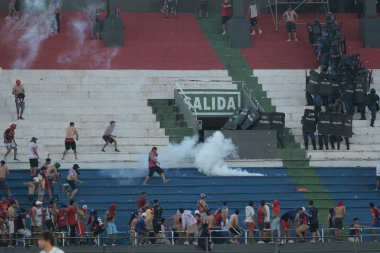 Several injured as fans clash with police in Paraguay’s Superclasico match