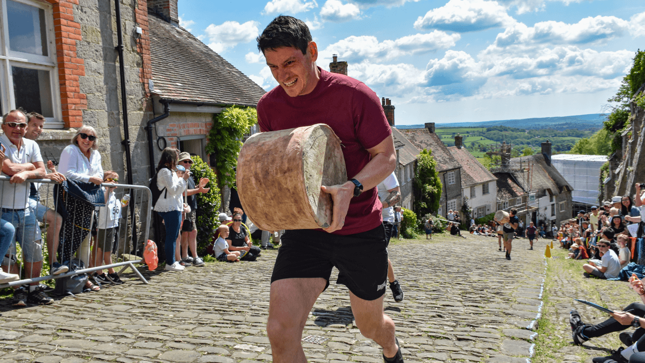 Why are people racing up a hill with a 23kg cheese?