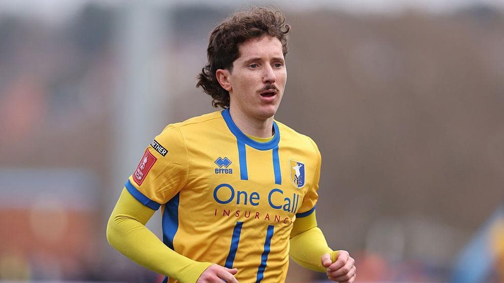 Midfielder Lewis among three leaving Mansfield