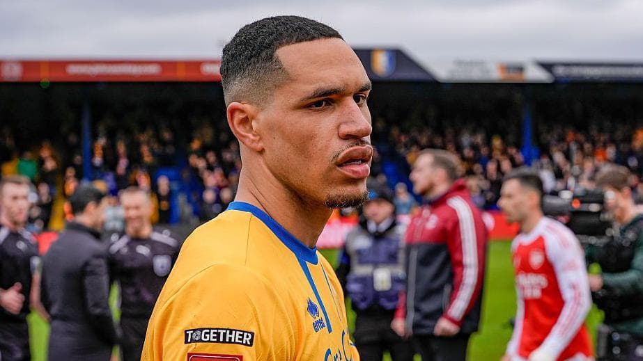 Mansfield sign midfielder Russell on two-year deal