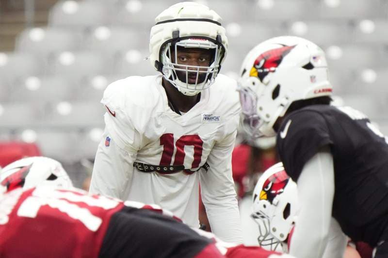 Why is this Arizona Cardinals defensive star sitting out of OTAs?