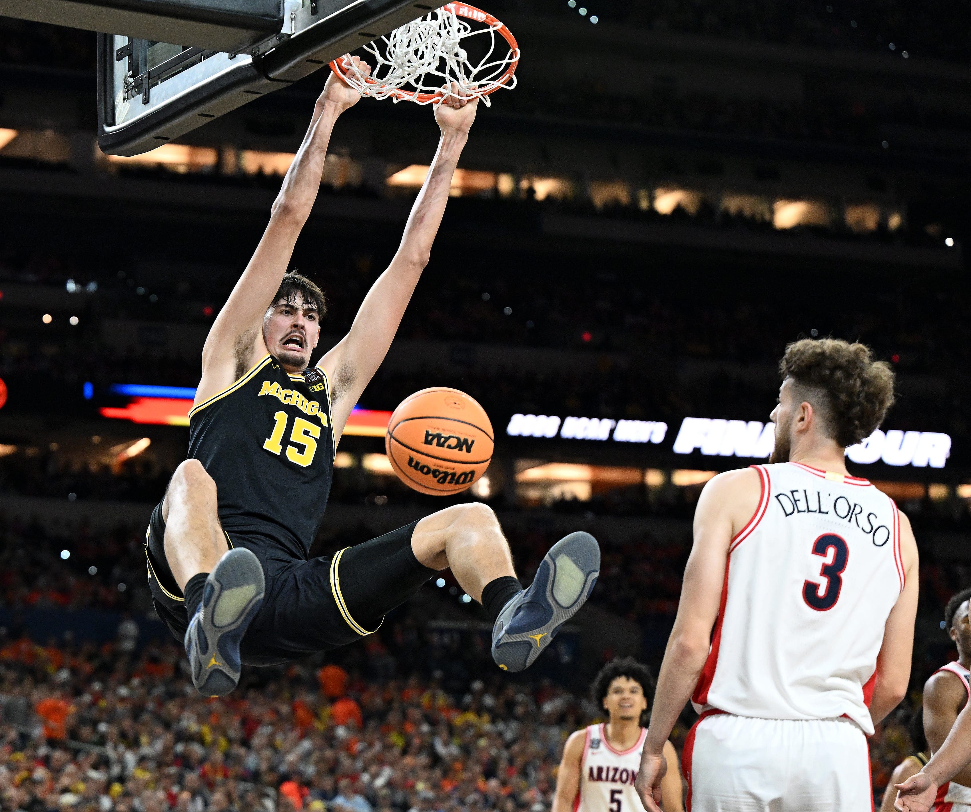 Is Michigan favored to win national championship against UConn?