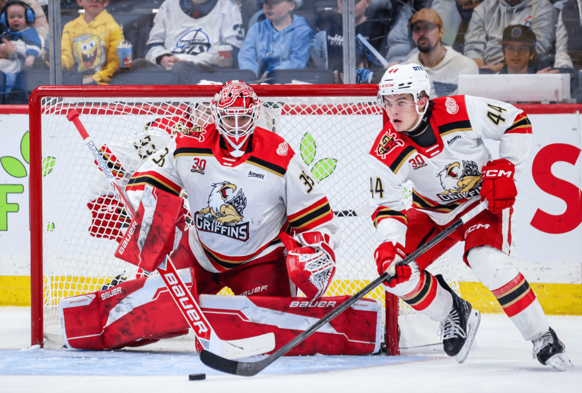 Wings prospect Cossa sits on the bench in AHL playoff opener