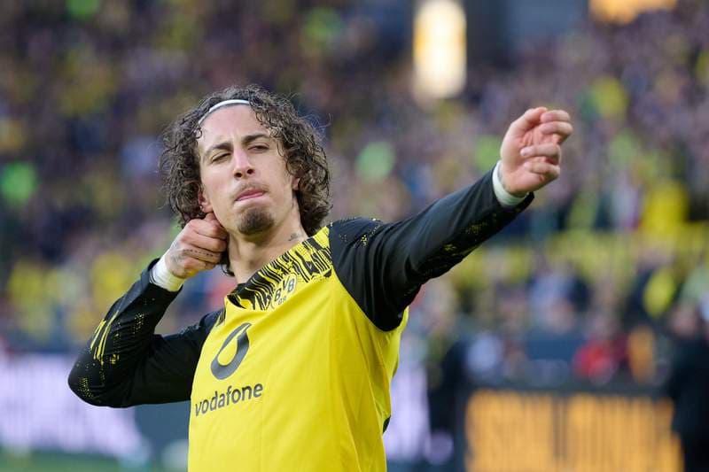 Dortmund beat Freiburg 4-0 to secure top four spot; Stuttgart held