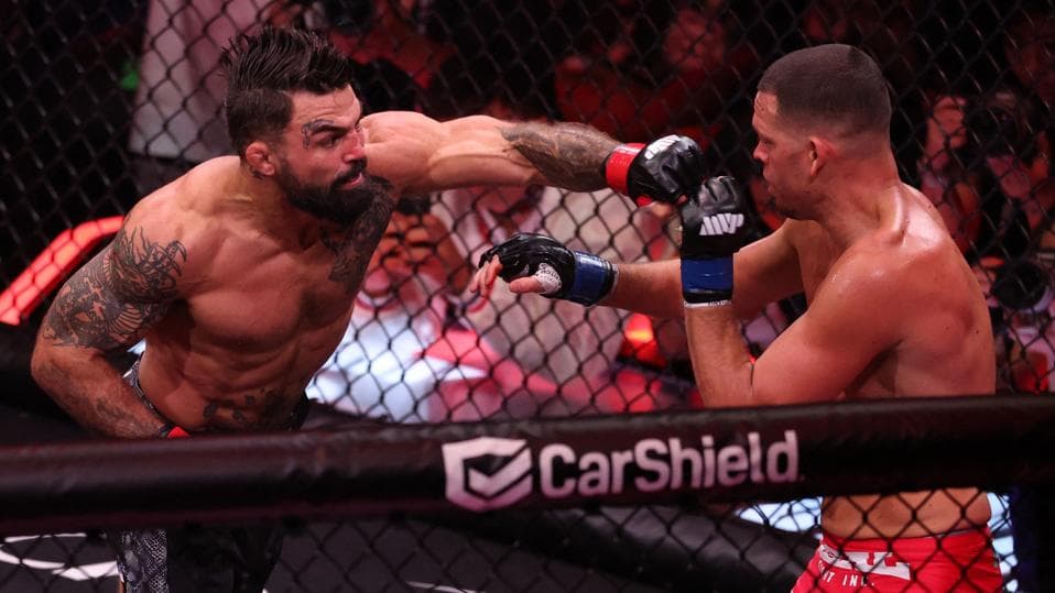 Mike Perry Batters Nate Diaz In Bloody TKO Win