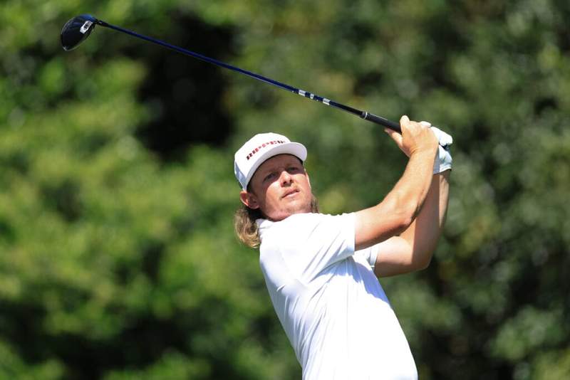 Jason Day reacts as Cameron Smith misses a sixth major cut in a row at The Masters