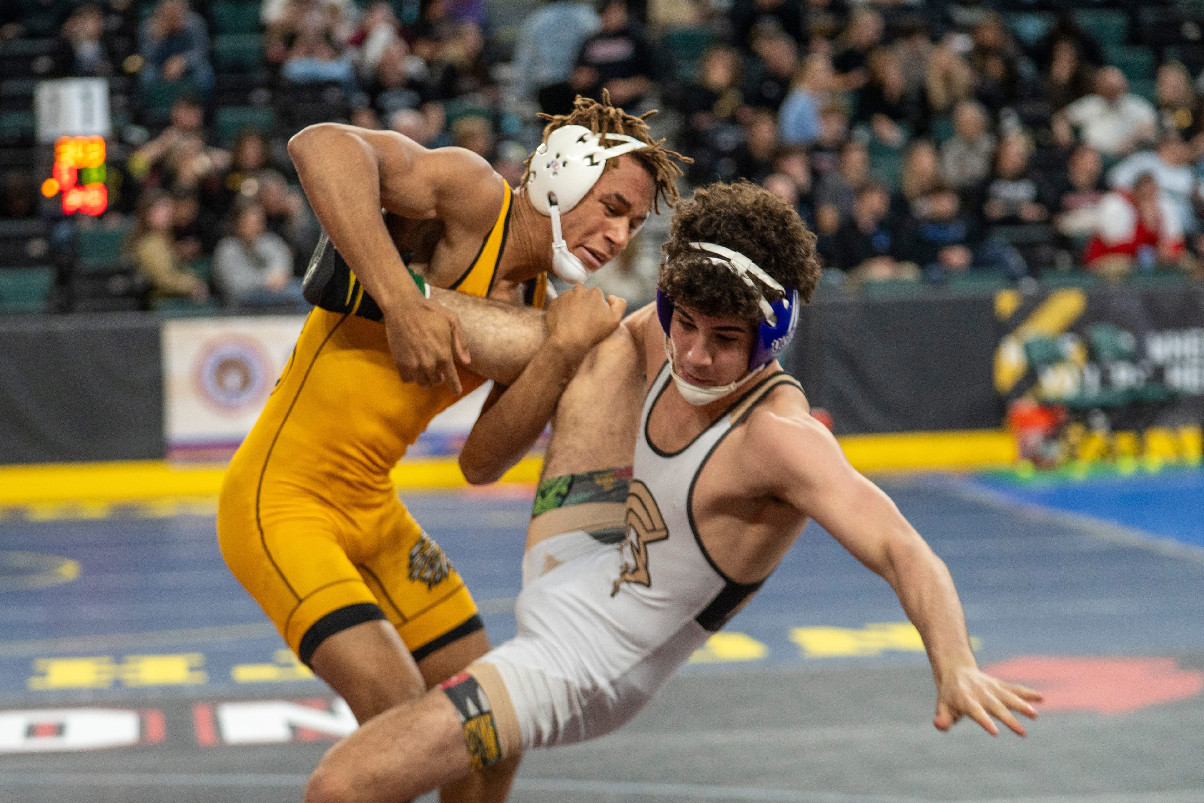 GMC's "Love," Schwarz, & Whitford Claim State Wrestling Title!