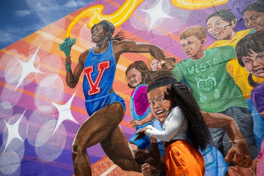 Once a 'sickly' child, Olympic medalist Brittany Brown now has a mural at her elementary school