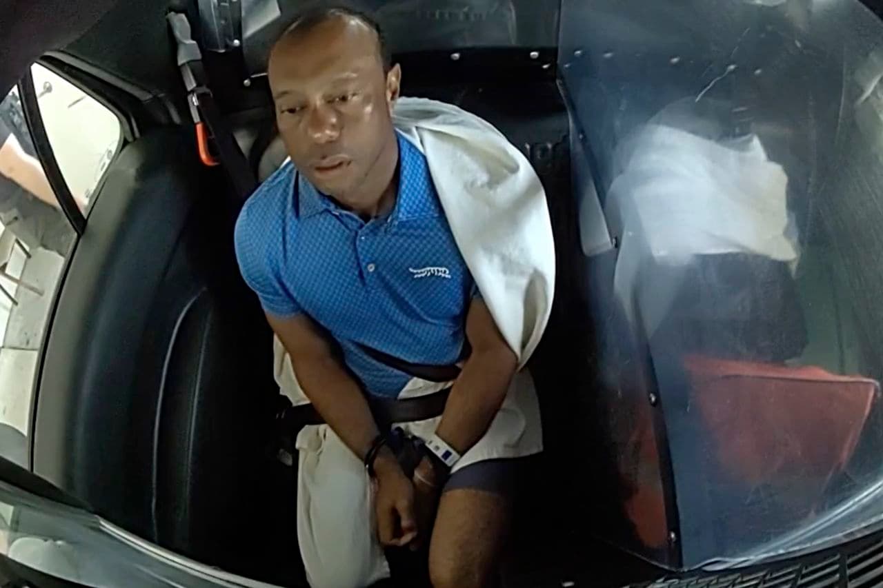 Tiger Woods Sits in Back of Police Car with Sheet Around Him in New Bodycam Footage