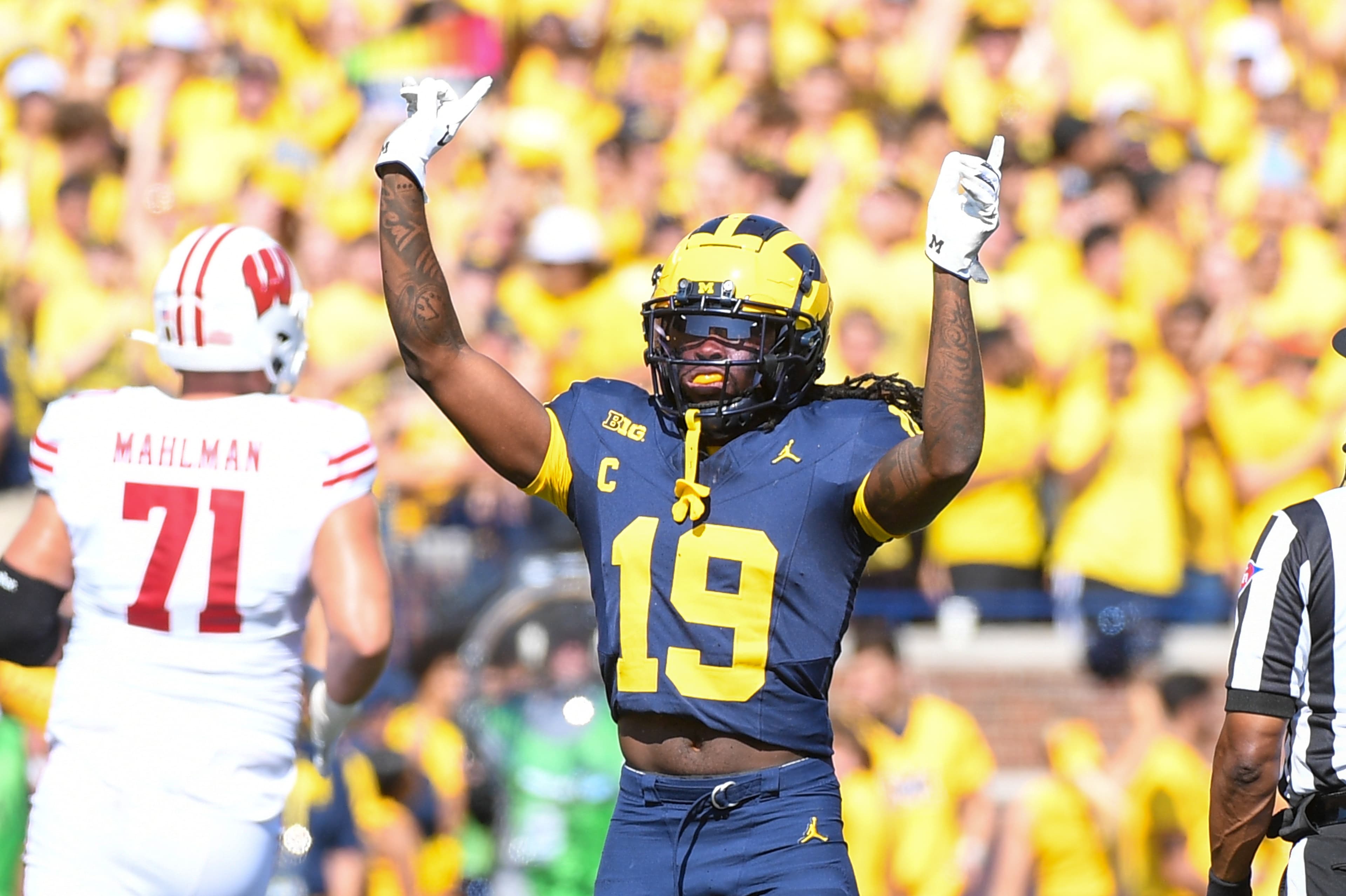 Newer Headline: "Wolverine Pros Smash Through Pain, Taking Back Crown