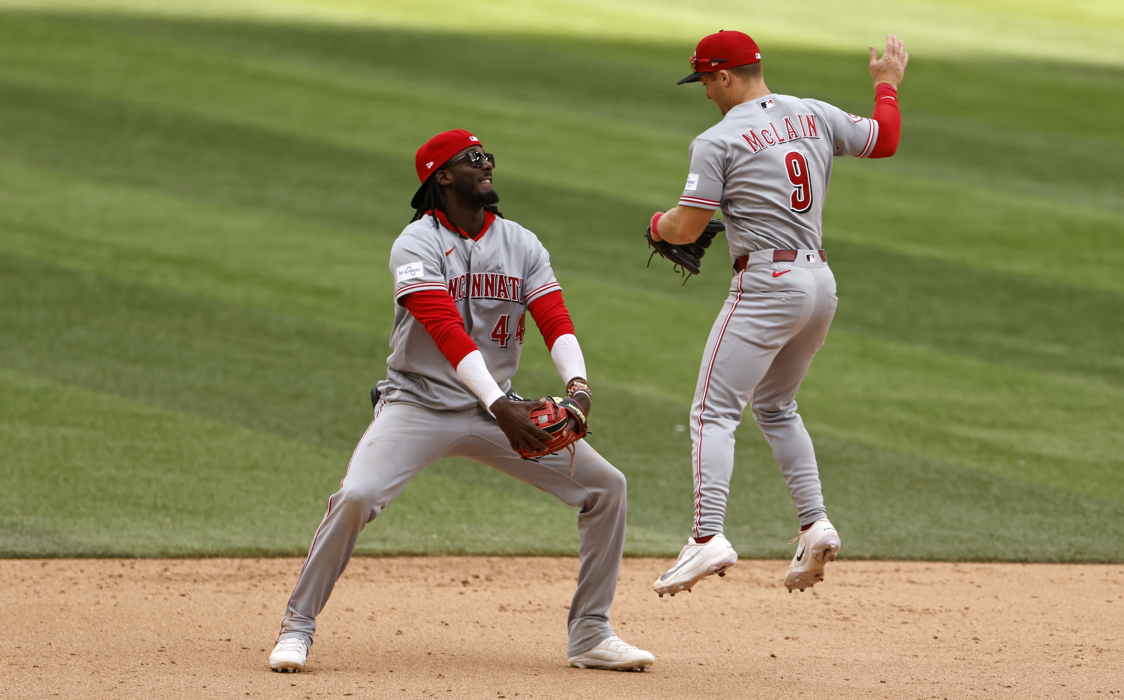 Reds storm back with late rally to beat Marlins in extra innings