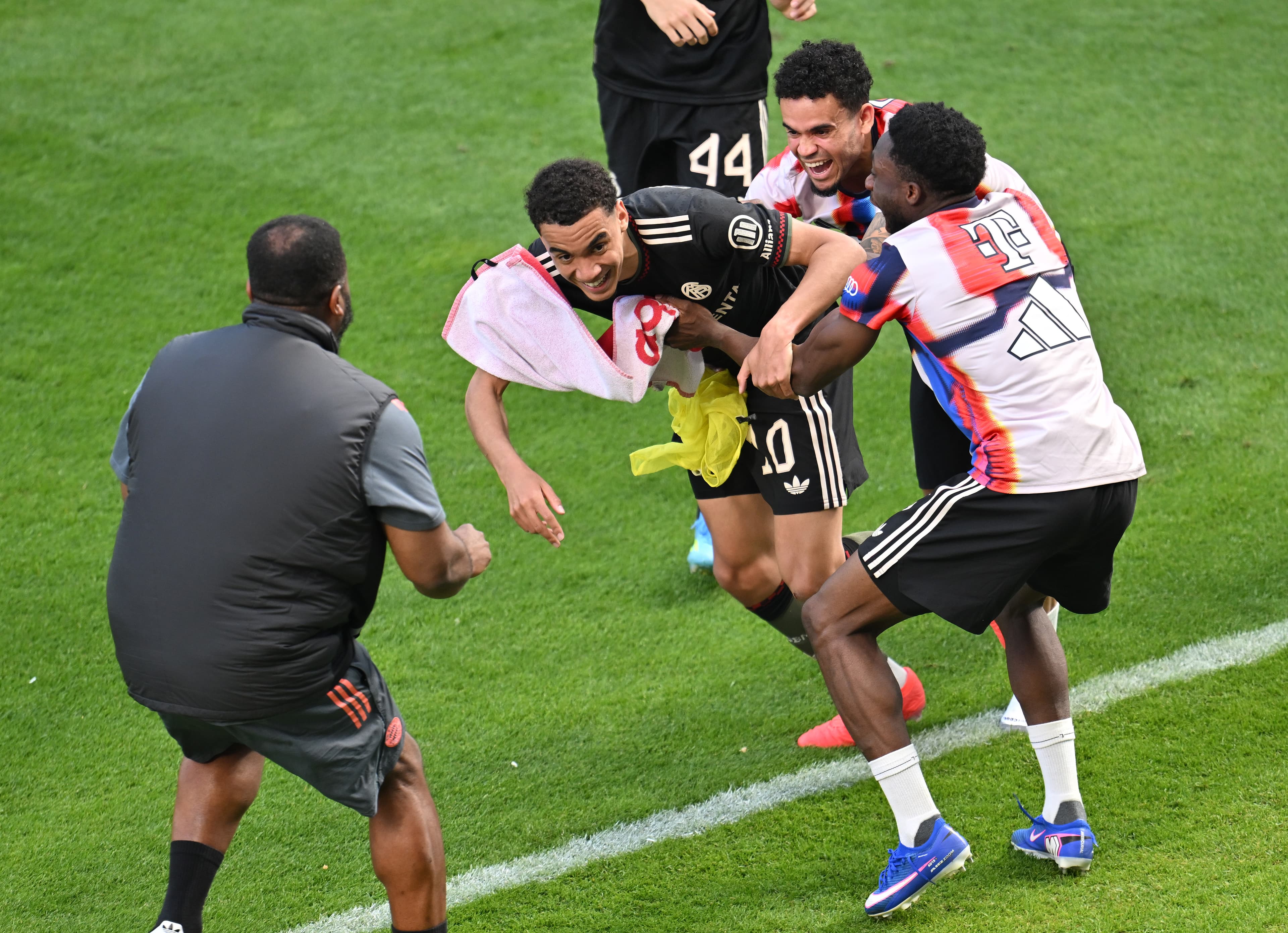 Bayern Munich’s Jamal Musiala gets mobbed following Mainz win