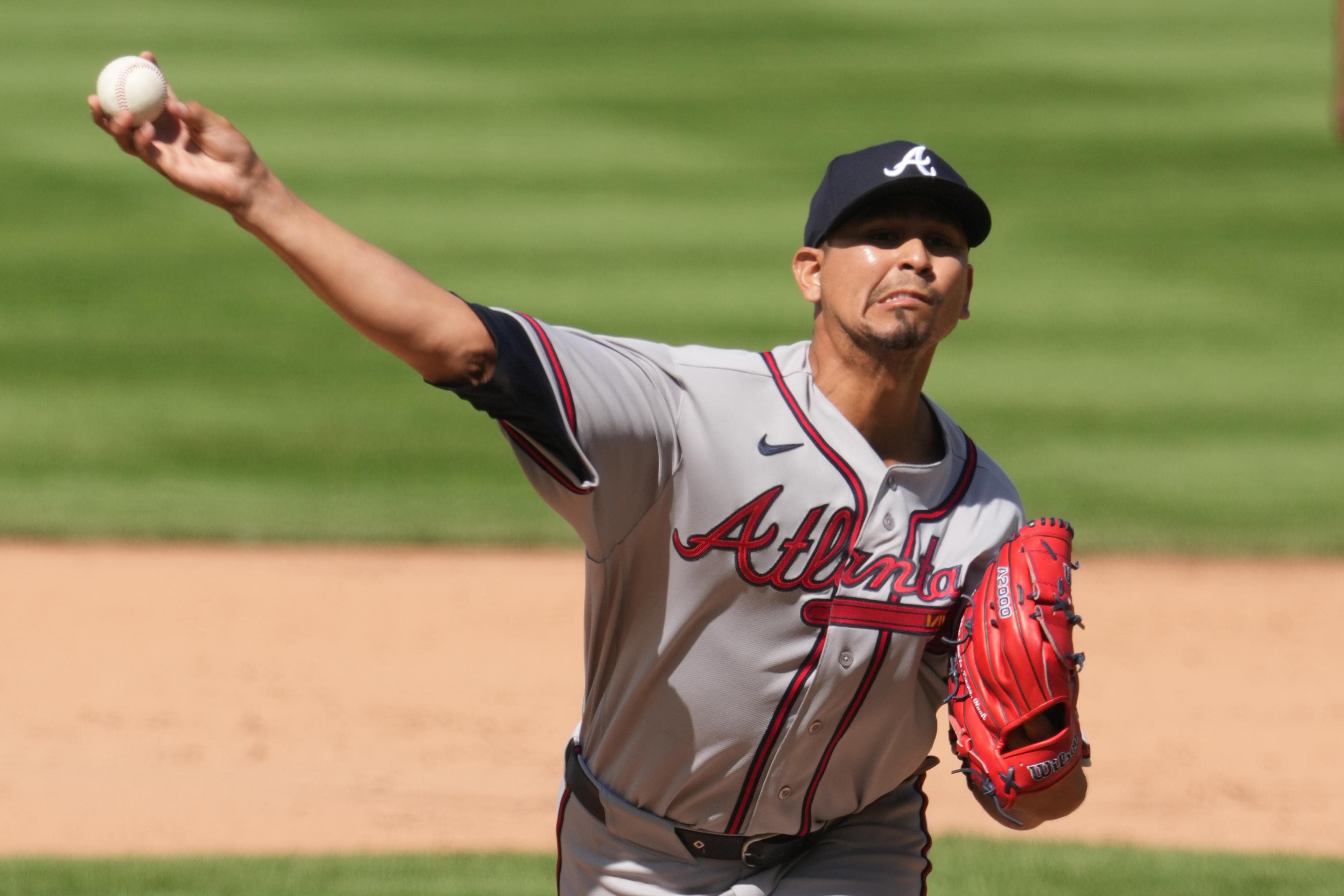 Braves re-add Carlos Carrasco, option Victor Mederos