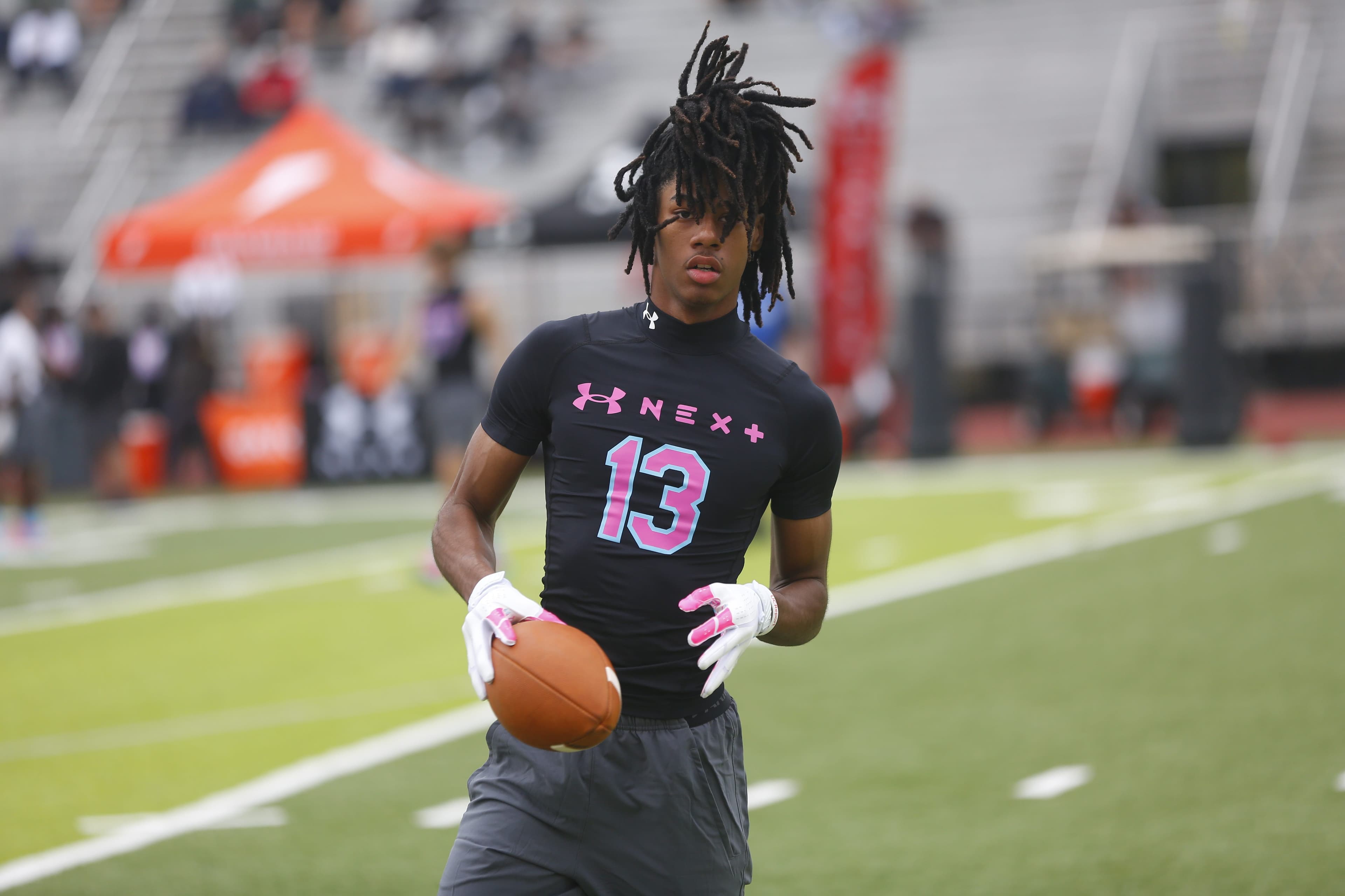 Who are the top football recruits at the FHSAA state track meet?