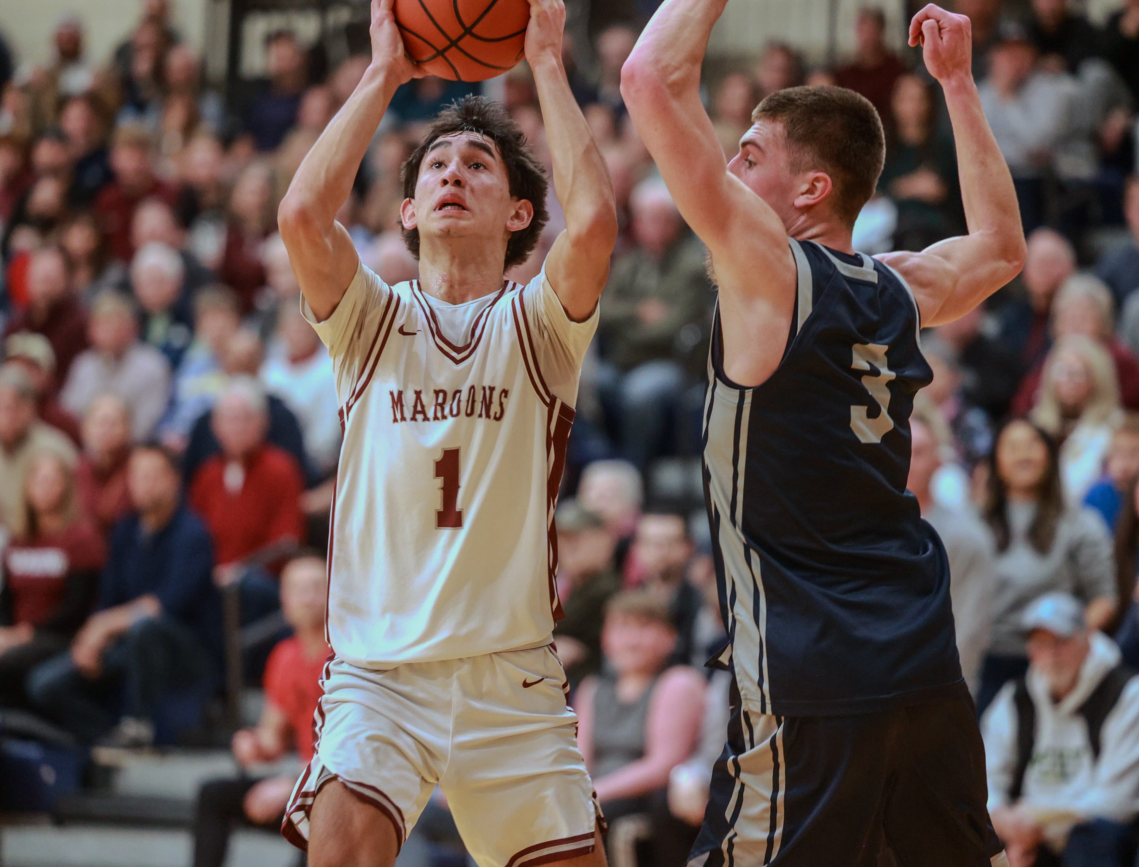 Holland Christian basketball players Titus Spencer, Jake Holcomb commit