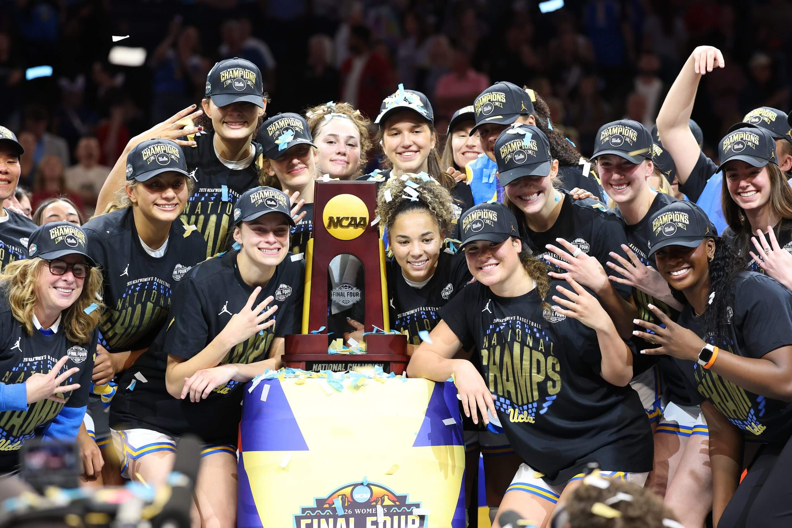 There and back again: UCLA star plays softball, jets to hoops celebration in same day