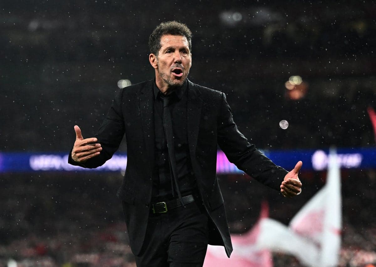 Arsenal fans heckle Diego Simeone after stepping on badge following Champions League defeat