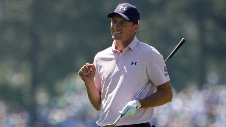 Jordan Spieth banks tee shot off patron's hand and onto fairway at 2026 Masters