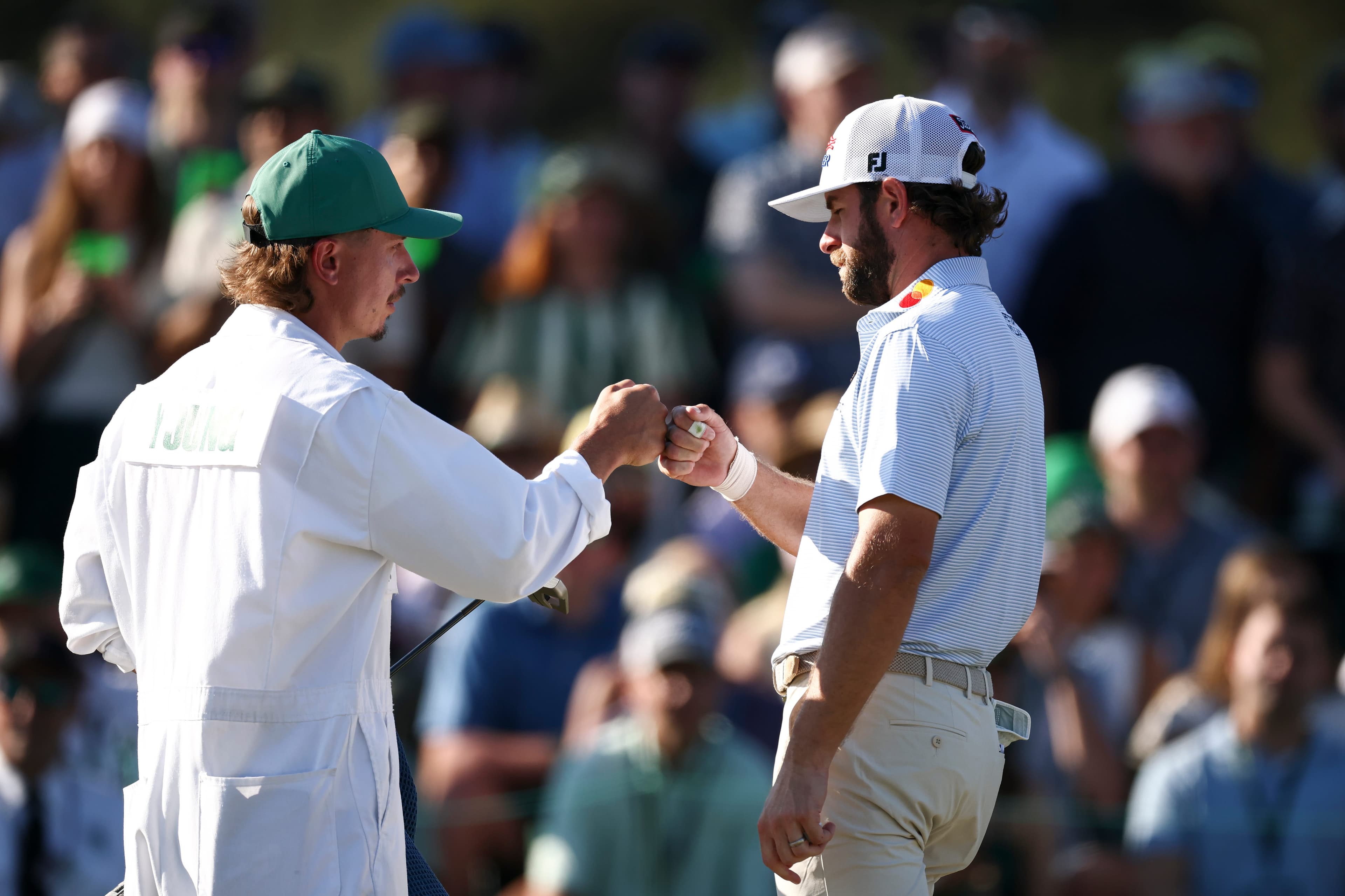 Cameron Young strikes early and late for share of Masters lead