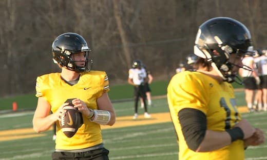 Iowa football players discuss ongoing QB battle