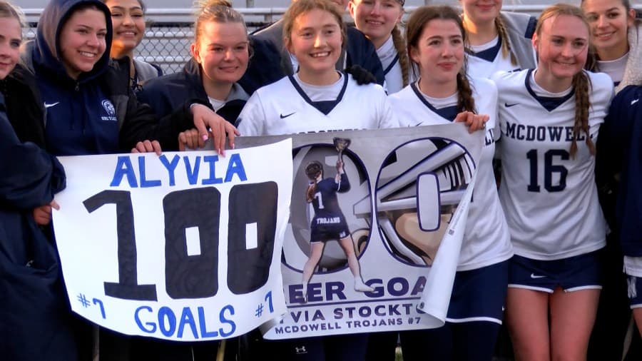 Trojans top Ramblers 12-2, Stockton hits 100 career goals in win