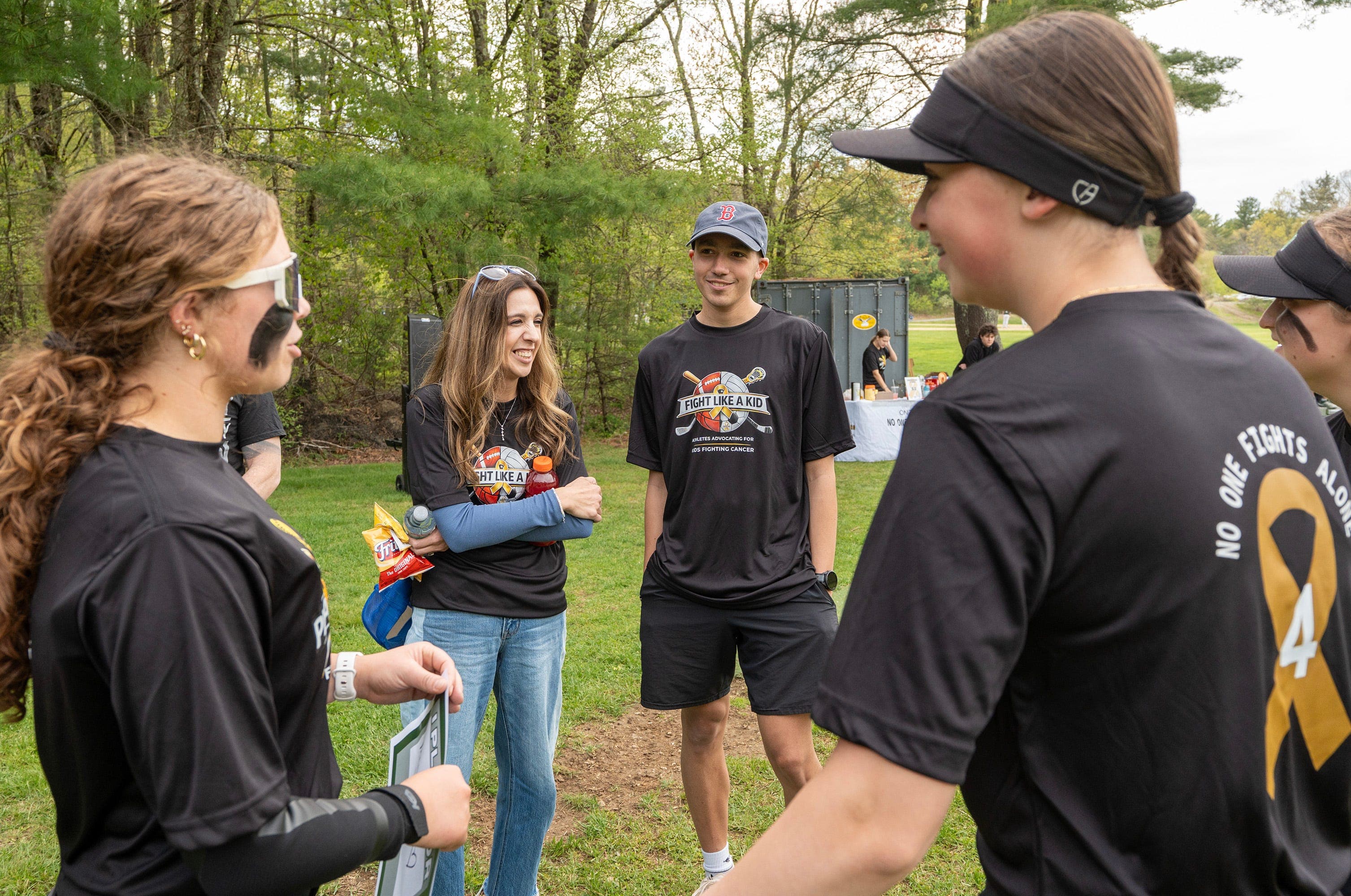 'No one fights alone': Nipmuc, St. Paul softball teams rally around Dudley teen battling brain cancer