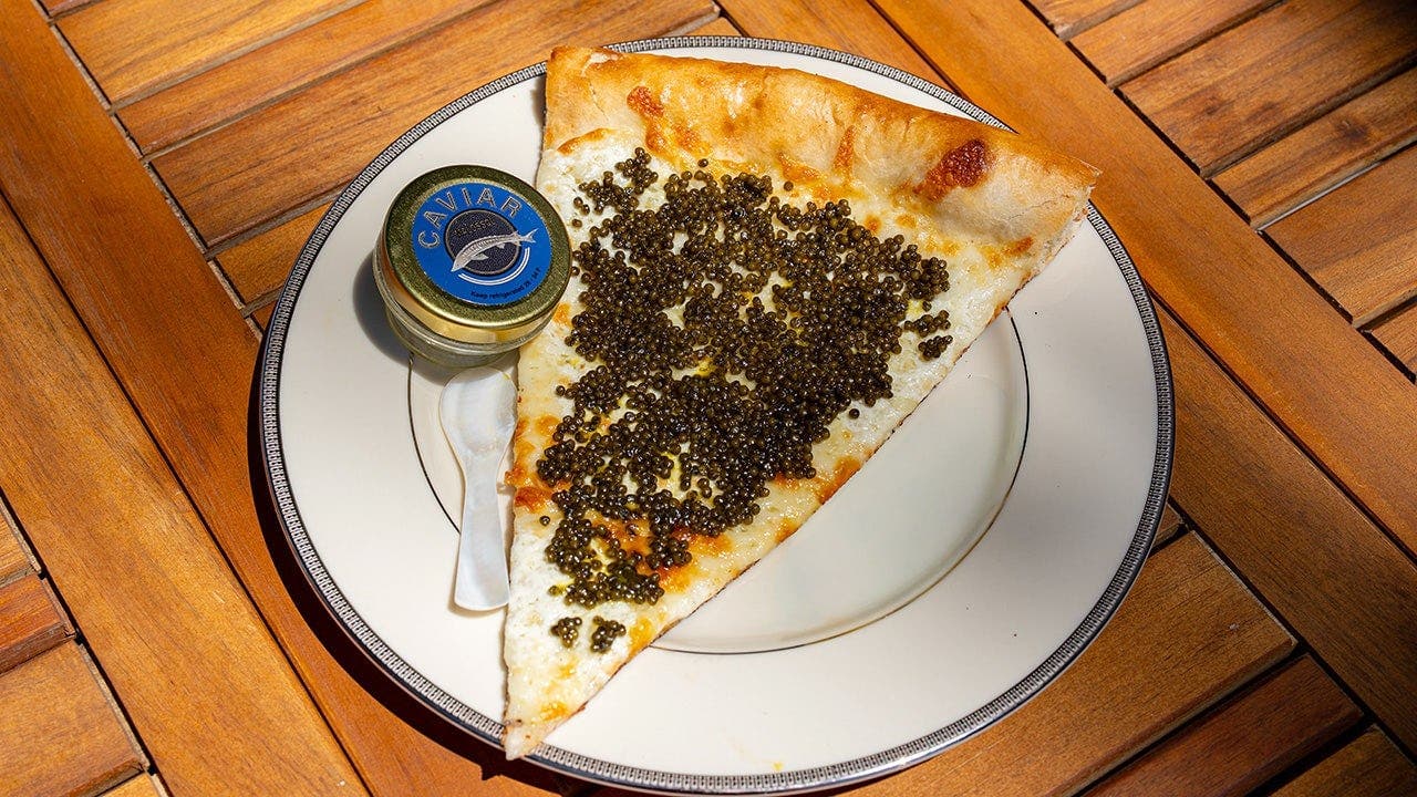 Philadelphia pizza shop sells $55 slices topped with caviar, served on gold plate with keepsake spoon
